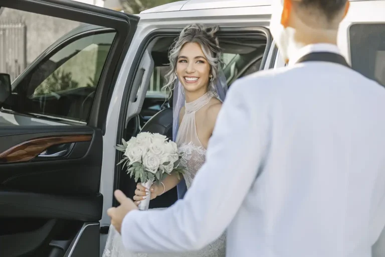 Las Vegas Wedding Couple coming out of Luxury Transportation